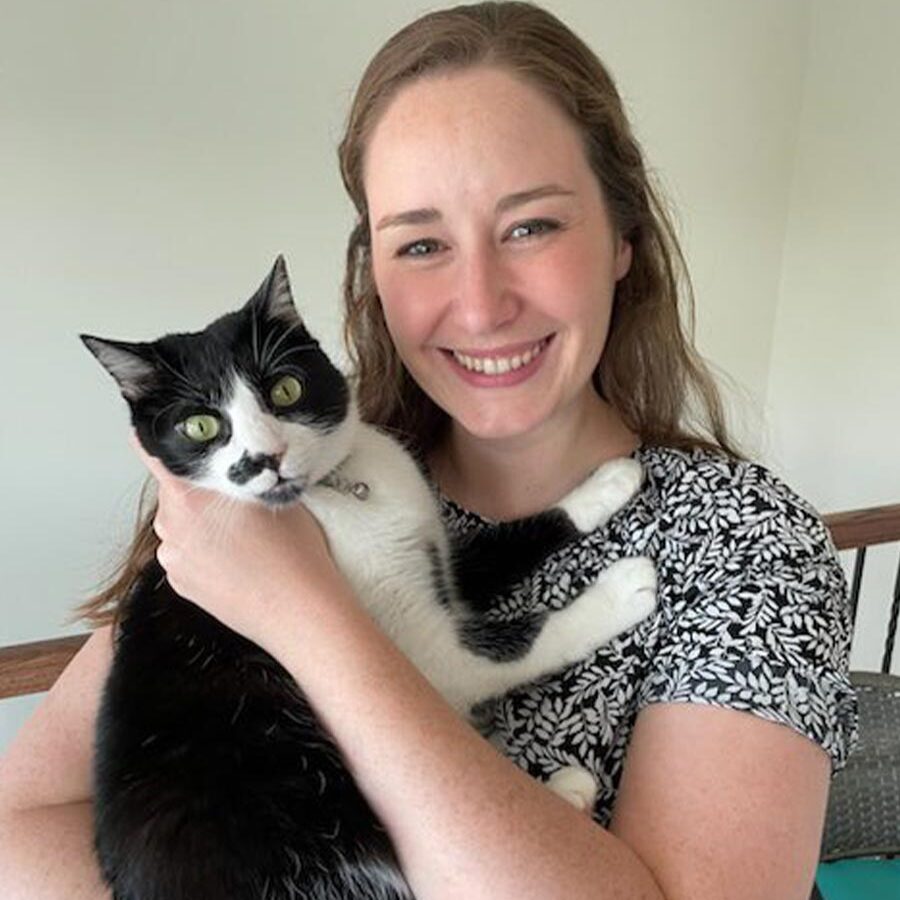 Dr. Katie Isbell Dr. Katie Isbell pictured holding a black and white cat