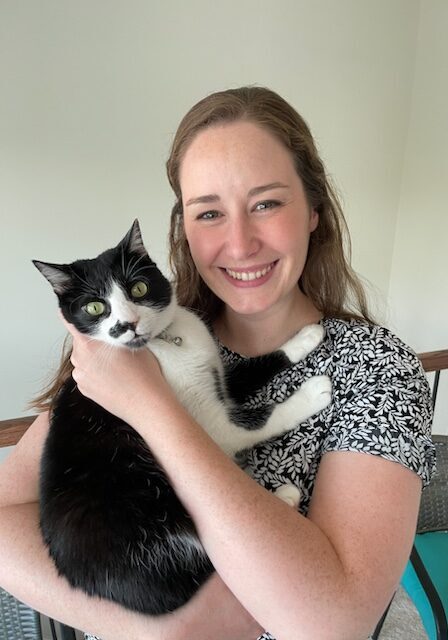 Dr. Katie Isbell Smiling holding cat