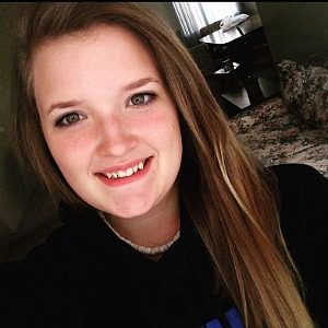 Kelsey, female with long straight brown hair with highlights and hazel eyes